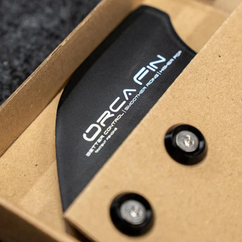 Close-up of ORCA twin-tip fins secured with M5 stainless steel screws and aluminium washers